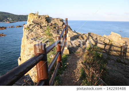 "Oiwa" (大岩), located on Oiwa Coast. Fukaura Town, Nishitsugaru District, Aomori Prefecture. A landscape of a rocky island. "Oiwa" (大岩), located on Oiwa Coast. Fukaura Town, Nishitsugaru District, Aomori Prefecture. A landscape of a rocky island. 142293486