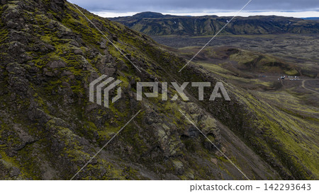 Moss-covered lava field slope with distant mountains, Skaft?rhreppur Iceland Moss-covered lava field slope with distant mountains, Skaft?rhreppur Iceland 142293643