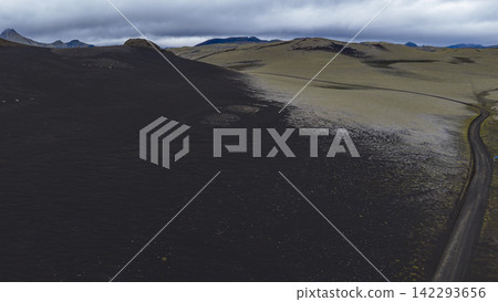 Aerial view of volcanic landscape with lava field and road, Skaft?rhreppur Iceland Aerial view of volcanic landscape with lava field and road, Skaft?rhreppur Iceland 142293656