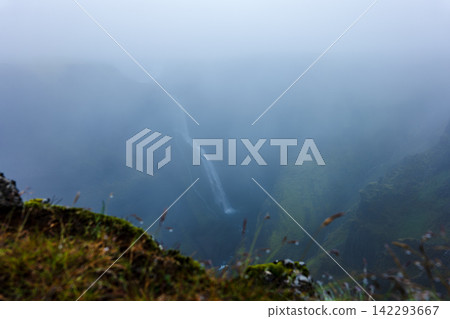 Misty Icelandic Valley with Waterfall and Moss-Covered Rocks Misty Icelandic Valley with Waterfall and Moss-Covered Rocks 142293667