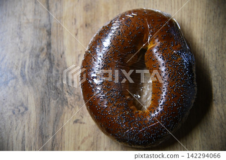 Fresh breakfast bread bagel roll isolated white Fresh breakfast bread bagel roll isolated white 142294066