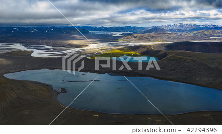 Aerial view of crater lake with glacial rivers, ytra Iceland Aerial view of crater lake with glacial rivers, ytra Iceland 142294396