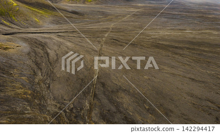Aerial view of glacial plain with vehicle track Iceland Aerial view of glacial plain with vehicle track Iceland 142294417