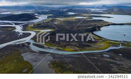 Aerial view of glacial river delta and volcanic terrain, ytra Iceland Aerial view of glacial river delta and volcanic terrain, ytra Iceland 142294511