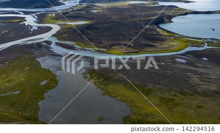 Aerial view of braided glacial river and tundra landscape, ytra Iceland Aerial view of braided glacial river and tundra landscape, ytra Iceland 142294516