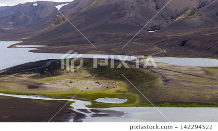Aerial view of volcanic terrain with glacial lakes and lava fields, Iceland 142294522