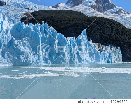 Blue Glacier Terminus With Forested Ridge and Mountain Ice Blue Glacier Terminus With Forested Ridge and Mountain Ice 142294751