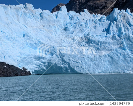 Massive Ice Front of Spegazzini Glacier Across Turquoise Water Massive Ice Front of Spegazzini Glacier Across Turquoise Water 142294779