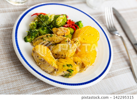 Chicken breast with vegetables on table Chicken breast with vegetables on table 142295315