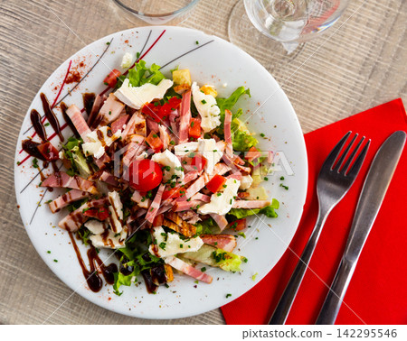 Tourangelle salad with bacon, cherry tomatoes and cheese Tourangelle salad with bacon, cherry tomatoes and cheese 142295546