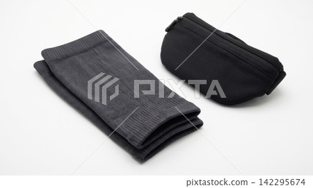 Folded dark grey fabric strap and pouch isolated on a white background with material accessory isolated background equipment hardware fastening industrial commercial 142295674