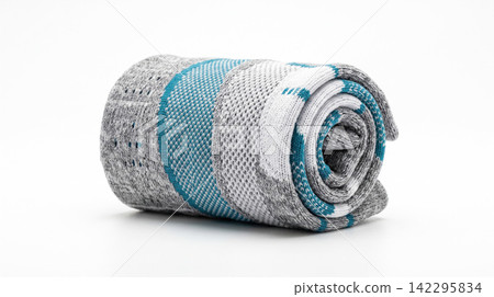 Rolled patterned fabric towel featuring white and turquoise stripes material turquoise geometric bathroom interior accessory isolated background commercial household Rolled patterned fabric towel featuring white and turquoise stripes material turquoise geometric bathroom interior accessory isolated background commercial household 142295834
