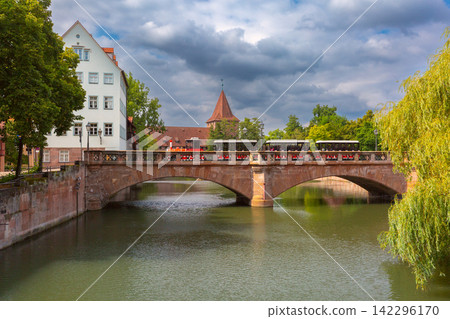 Historic Bridge and Tourist Train in Nuremberg Old Town, Germany Historic Bridge and Tourist Train in Nuremberg Old Town, Germany 142296170