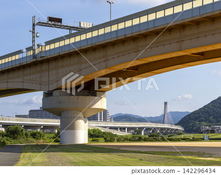 A bridge on the Hanshin Expressway Route 11 Ikeda Line crossing the Inagawa River. A bridge on the Hanshin Expressway Route 11 Ikeda Line crossing the Inagawa River. 142296434