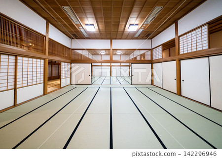 Traditional tatami room with sliding doors and symmetrical interior at Saga Castle, Japan 142296946