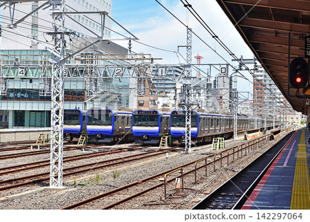 Sobu Line trains parked in four rows near the platform at Kinshicho Station. Sobu Line trains parked in four rows near the platform at Kinshicho Station. 142297064