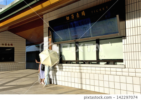 Women taking commemorative photos at the ticket office of Ryogoku Kokugikan during the off-season. Women taking commemorative photos at the ticket office of Ryogoku Kokugikan during the off-season. 142297074