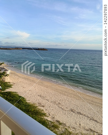 A view of the beach in Yomitan, Okinawa Prefecture, on a July morning from a window. A view of the beach in Yomitan, Okinawa Prefecture, on a July morning from a window. 142297893