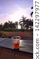 A resort hotel on the west coast of Okinawa Prefecture: Enjoying cocktails while watching the sunset. 142297977