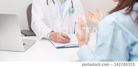 Doctor and patient having a medical consultation for Teal and white ribbon concept of January Cervical Cancer Awareness month, September Ovarian Cancer, PCOS, April Sexual Assault Doctor and patient having a medical consultation for Teal and white ribbon concept of January Cervical Cancer Awareness month, September Ovarian Cancer, PCOS, April Sexual Assault 142298353