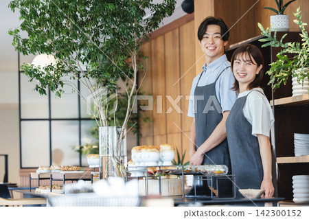 Male and female part-time staff who guide customers through the food at markets and cafes. 142300152