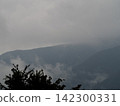 Mountains shrouded in mist 142300331