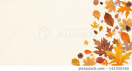 Fall. Autumn leaves and pine cones scatter across a textured backdrop Fall. Autumn leaves and pine cones scatter across a textured backdrop 142300388
