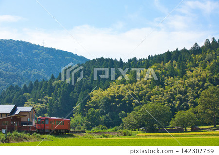 A local train running through the scorching heat A local train running through the scorching heat 142302739