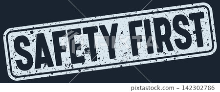 safety first stamp. safety first white rectangular grunge stamp on dark blue background safety first stamp. safety first white rectangular grunge stamp on dark blue background 142302786