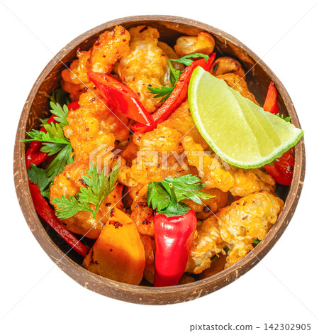 Crispy fried cauliflower with chili pepper and lime in coconut bowl isolated top view vegan appetizer 142302905