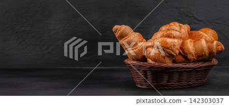 Basket of Croissants on Dark Background with Copy Space Basket of Croissants on Dark Background with Copy Space 142303037