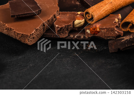 Broken Chocolate with Hazelnuts and Cinnamon Broken Chocolate with Hazelnuts and Cinnamon 142303158