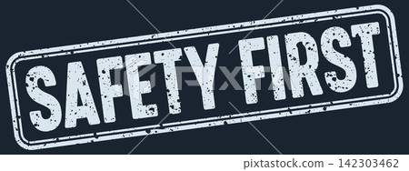 safety first white grunge stamp on dark blue background. safety first stamp safety first white grunge stamp on dark blue background. safety first stamp 142303462