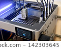 3D printer in the middle of printing 142303645