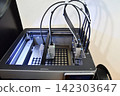 3D printer in the middle of printing 142303647