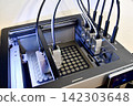 3D printer in the middle of printing 142303648