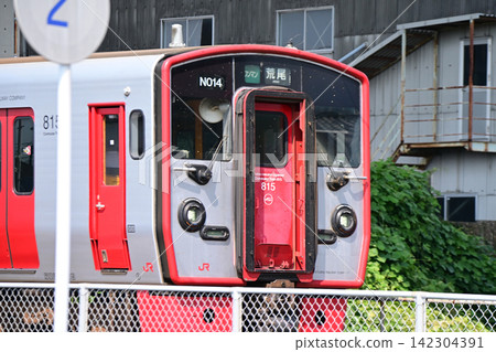 A red train running on the tracks A red train running on the tracks 142304391