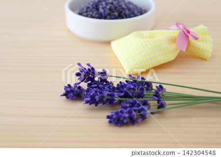 The image is of making lavender potpourri and scented sachets by hand. The image is of making lavender potpourri and scented sachets by hand. 142304548