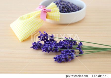 The image is of making lavender potpourri and scented sachets by hand. The image is of making lavender potpourri and scented sachets by hand. 142304549