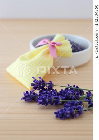 The image is of making lavender potpourri and scented sachets by hand. The image is of making lavender potpourri and scented sachets by hand. 142304550