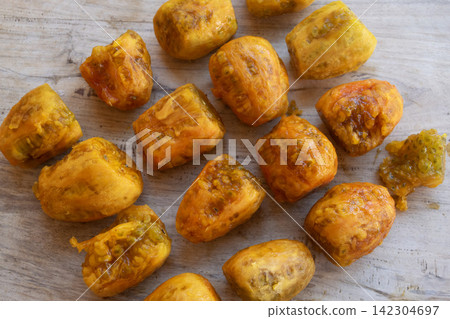 peeled prickly pears on wooden background peeled prickly pears on wooden background 142304697