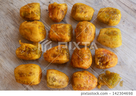 peeled prickly pears on wooden background peeled prickly pears on wooden background 142304698