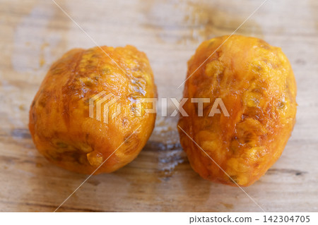 peeled prickly pears on wooden background peeled prickly pears on wooden background 142304705