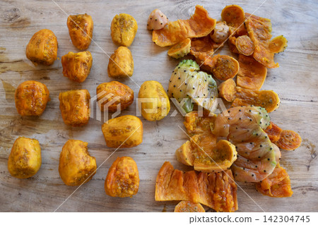 Prickly pear fruit peels wooden board Prickly pear fruit peels wooden board 142304745