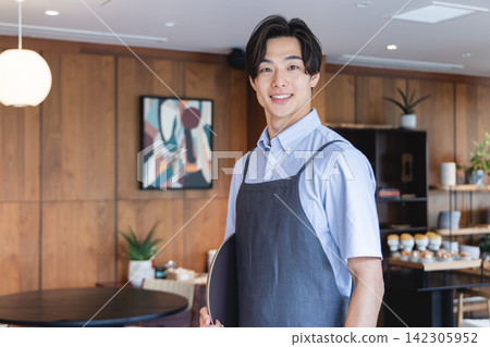 Male cafe staff Male cafe staff 142305952