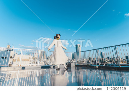 A woman dancing while listening to music A woman dancing while listening to music 142306519