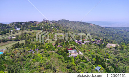 Aerial view of the area near the summit of Mount Maya, showing the observation deck and villa area. Aerial view of the area near the summit of Mount Maya, showing the observation deck and villa area. 142306661