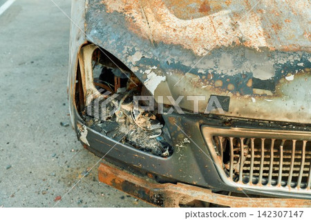 Destroyed Headlight Socket on Rusted Car Wing Panel After Fire Destroyed Headlight Socket on Rusted Car Wing Panel After Fire 142307147