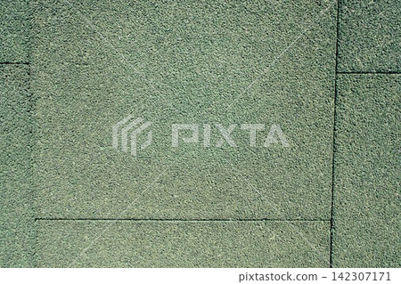 Granular green rubber crumb surface texture close up Granular green rubber crumb surface texture close up 142307171
