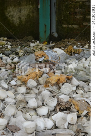 Abandoned factory floor full of discarded ceramic waste Abandoned factory floor full of discarded ceramic waste 142308933